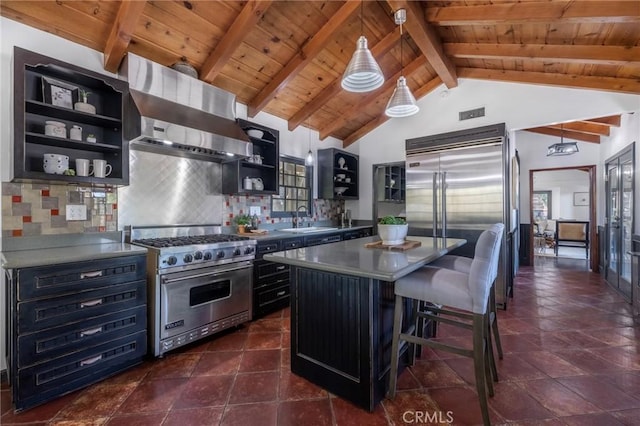 kitchen featuring sink, premium appliances, vaulted ceiling with beams, ventilation hood, and a kitchen island