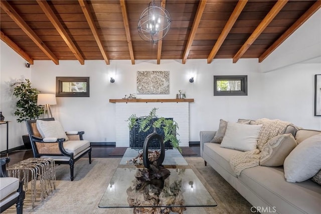 living room with lofted ceiling with beams, wooden ceiling, and a notable chandelier