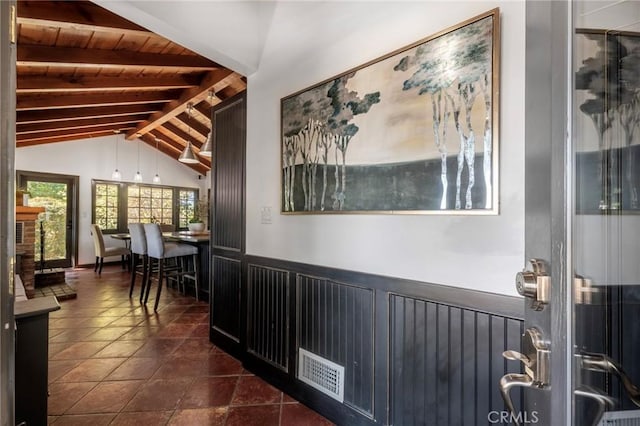 hall with vaulted ceiling with beams and wooden ceiling