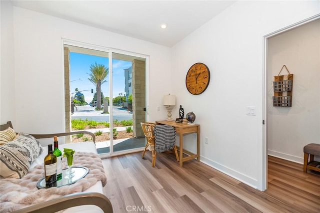 living area with light hardwood / wood-style flooring