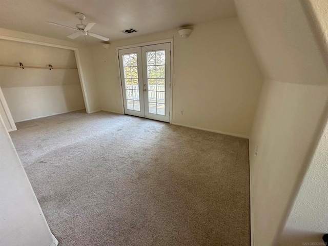 interior space featuring french doors and carpet