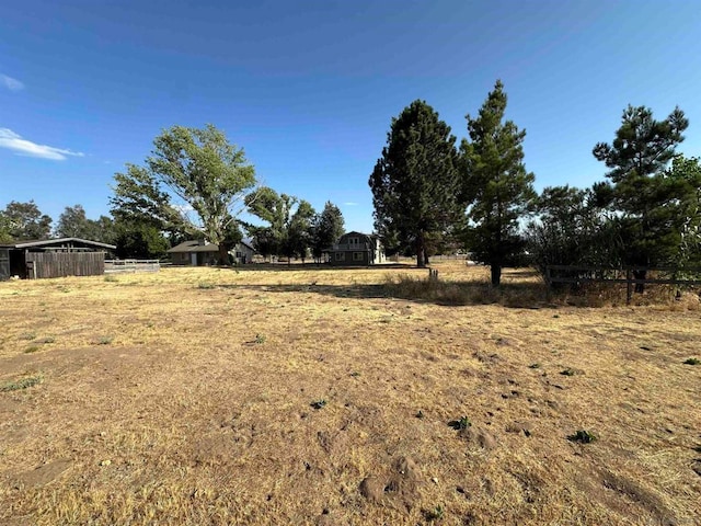 view of yard with a rural view