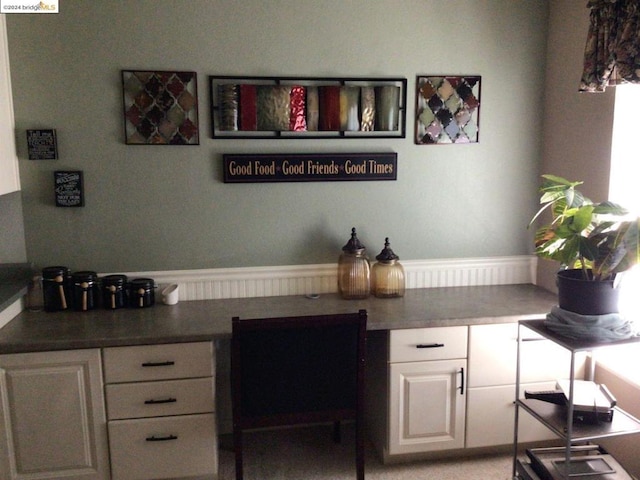 bar featuring white cabinets