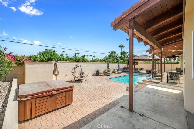 view of pool with a patio, a hot tub, and ceiling fan