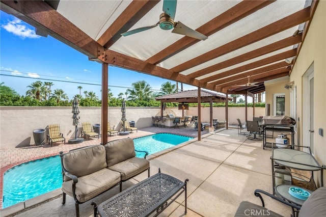 view of swimming pool with a fenced in pool, an outdoor living space, a patio area, and a ceiling fan