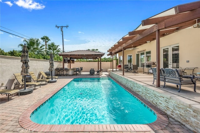 view of swimming pool featuring a gazebo and a patio area