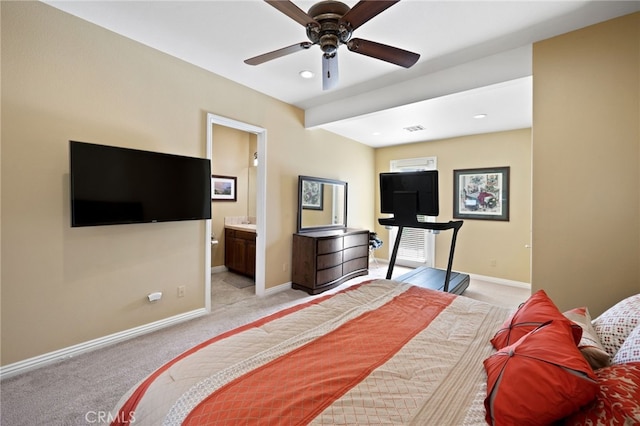 carpeted bedroom featuring ensuite bathroom and ceiling fan