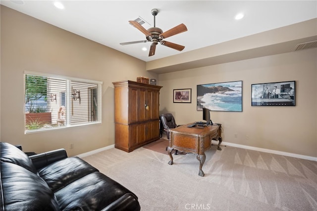 office with light carpet and ceiling fan