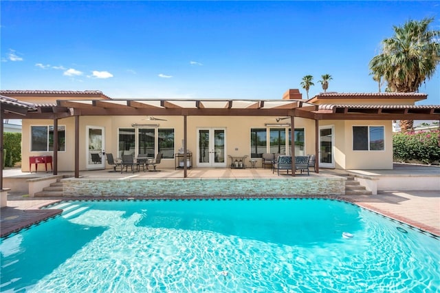 back of property with french doors and a patio area