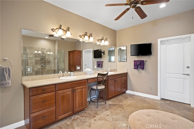 bathroom featuring vanity, walk in shower, and ceiling fan