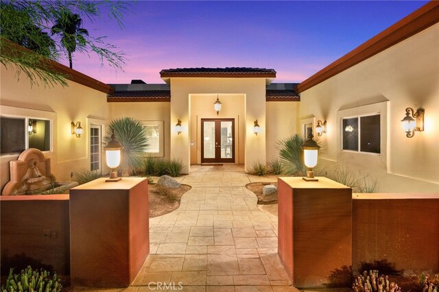 exterior space featuring french doors and a patio area