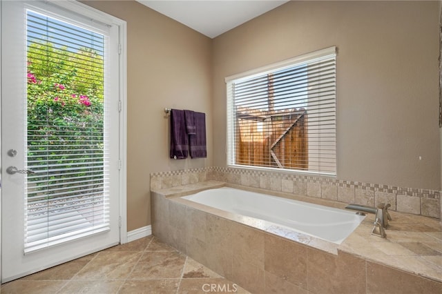 bathroom with tiled bath