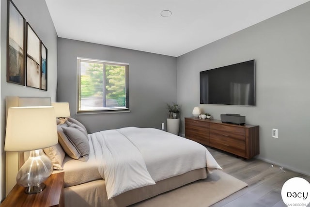 bedroom with light hardwood / wood-style flooring