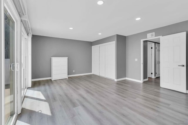 empty room with hardwood / wood-style floors