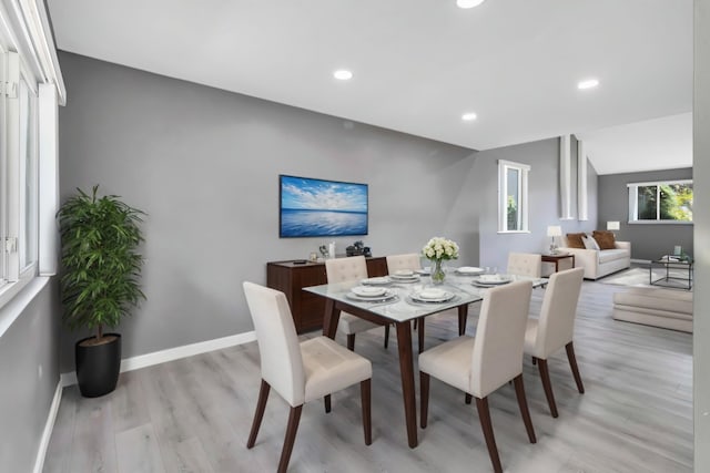 dining area with light hardwood / wood-style floors