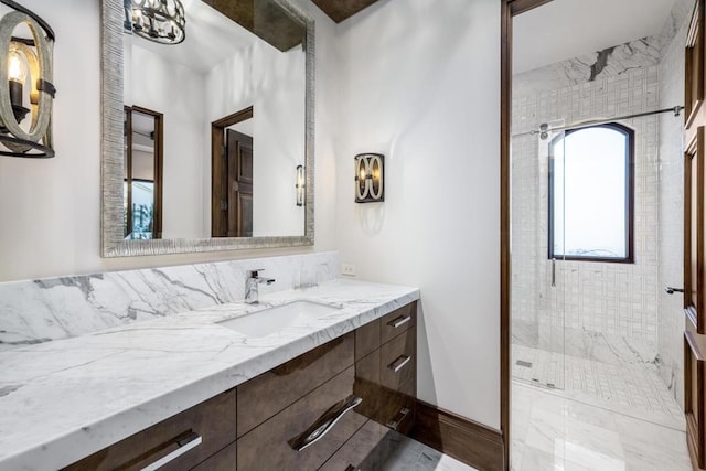 bathroom featuring vanity and an enclosed shower