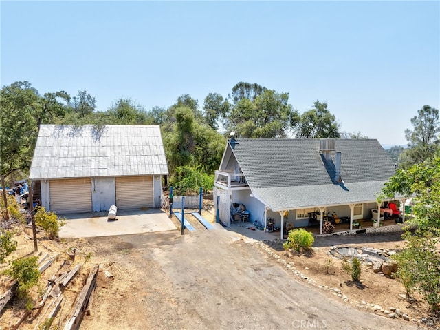 view of front of house with an outbuilding