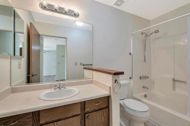 full bathroom featuring vanity, toilet, and  shower combination