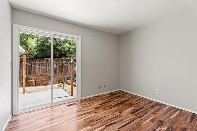 empty room featuring wood-type flooring