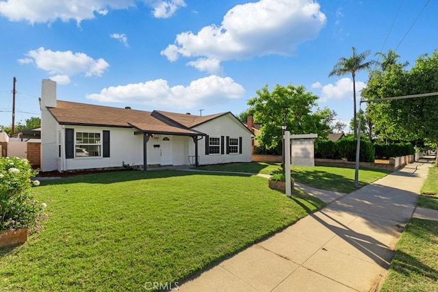 single story home featuring a front yard