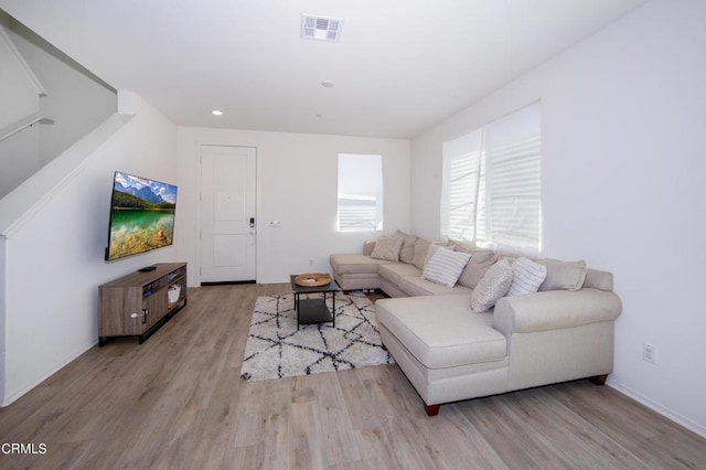 living room with light hardwood / wood-style flooring