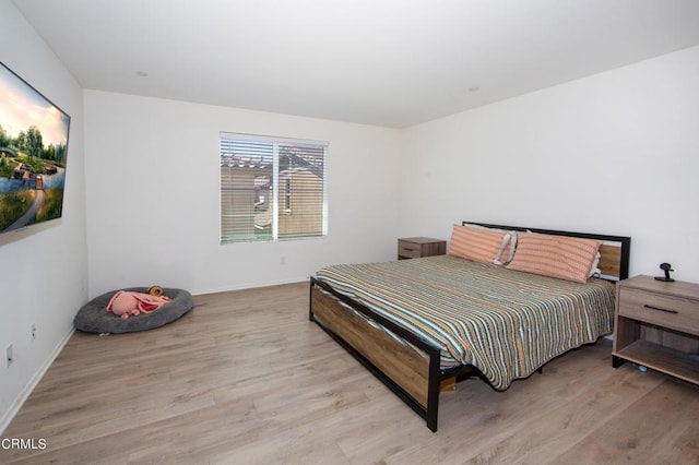 bedroom with light hardwood / wood-style flooring