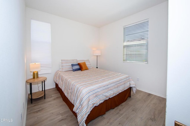 bedroom featuring light wood-type flooring