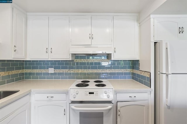 kitchen with white appliances, white cabinetry, and backsplash