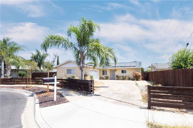 ranch-style house featuring a garage