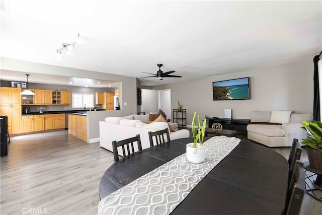 dining room featuring ceiling fan and light hardwood / wood-style flooring