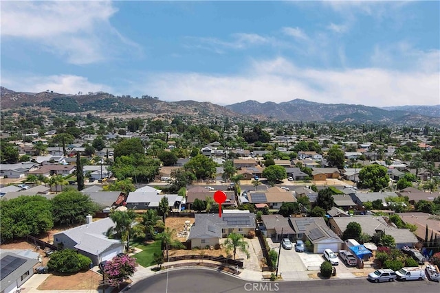 birds eye view of property with a mountain view