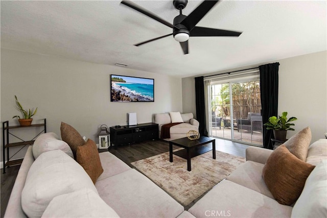 living room with ceiling fan and hardwood / wood-style floors