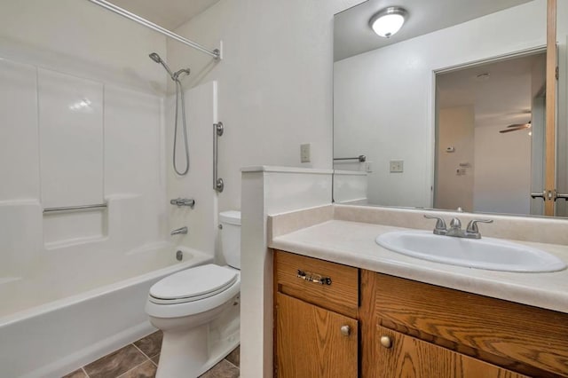 full bathroom with vanity, bathtub / shower combination, tile patterned floors, and toilet