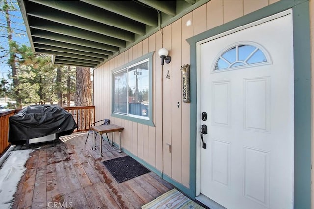 doorway to property with a wooden deck