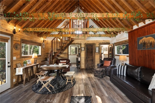 interior space with wooden walls, beam ceiling, dark hardwood / wood-style flooring, and high vaulted ceiling