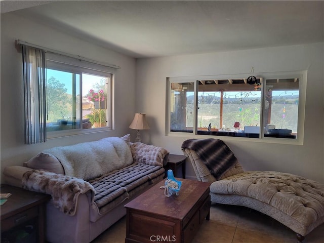 living room with tile patterned flooring