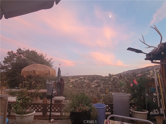 3131 Whispering Pines Rd, Wrightwood, CA 92397 - patio terrace at dusk featuring a mountain view