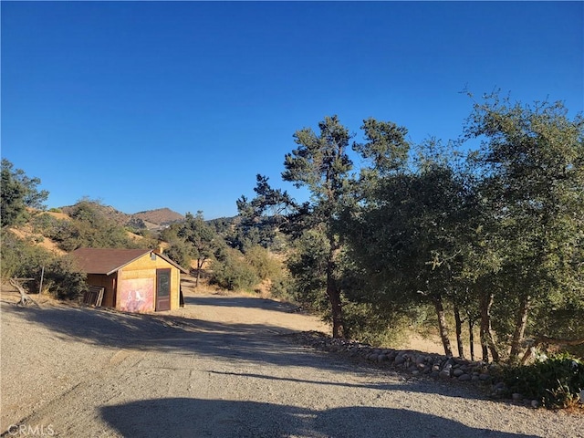 3131 Whispering Pines Rd, Wrightwood, CA 92397 - view of dirt / gravel driveway with a mountain view