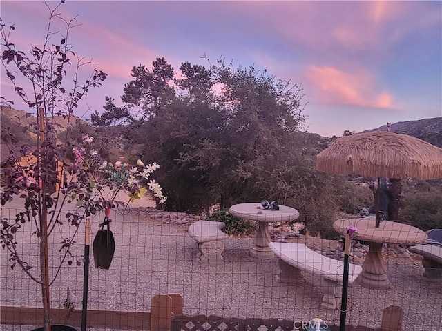 view of patio terrace at dusk