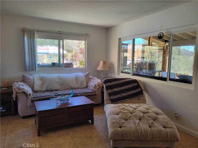 living room with light tile patterned floors and a wealth of natural light