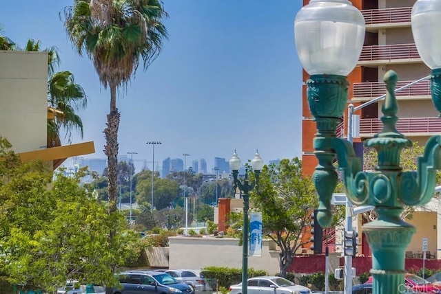 exterior space featuring a view of city and street lights