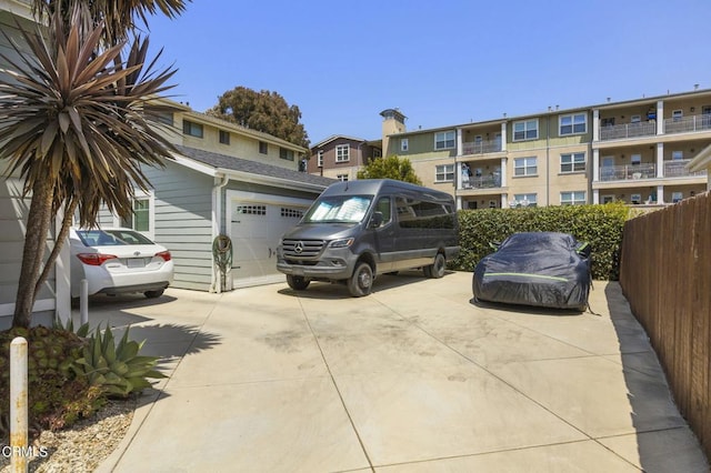 view of parking / parking lot with a garage