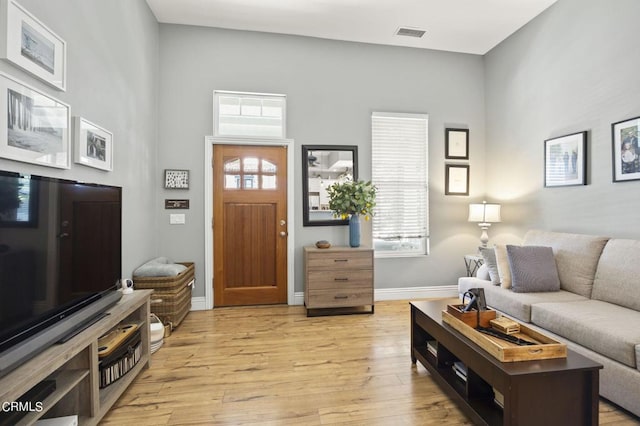 living room with light hardwood / wood-style floors