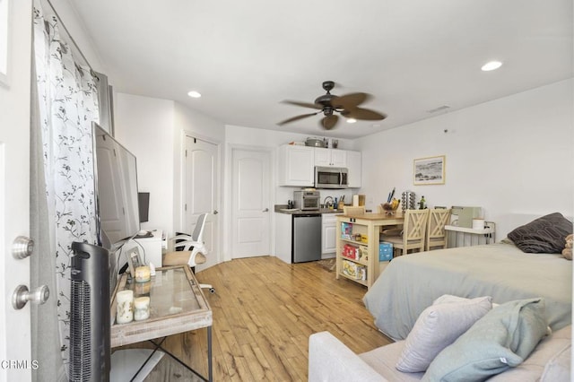 interior space featuring light hardwood / wood-style floors and ceiling fan