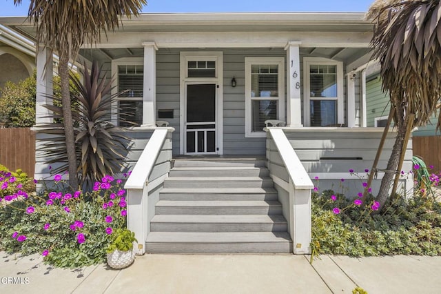 doorway to property featuring a porch