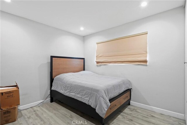 bedroom featuring light wood-type flooring