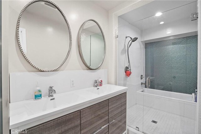 bathroom with vanity and independent shower and bath