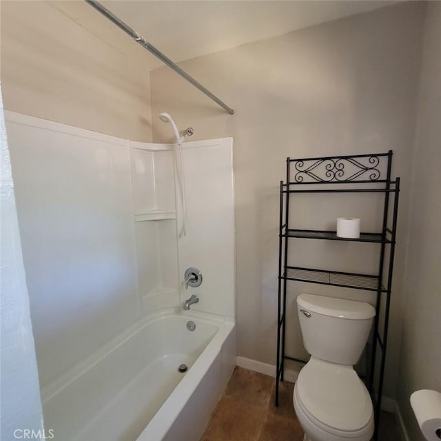 bathroom with shower / bath combination and toilet