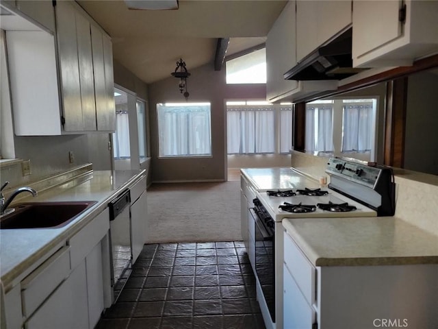 kitchen with white appliances, sink, dark colored carpet, vaulted ceiling with beams, and white cabinetry