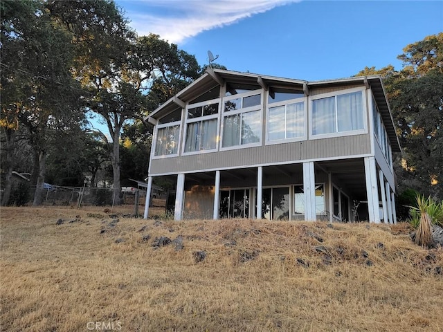 back of house with a sunroom